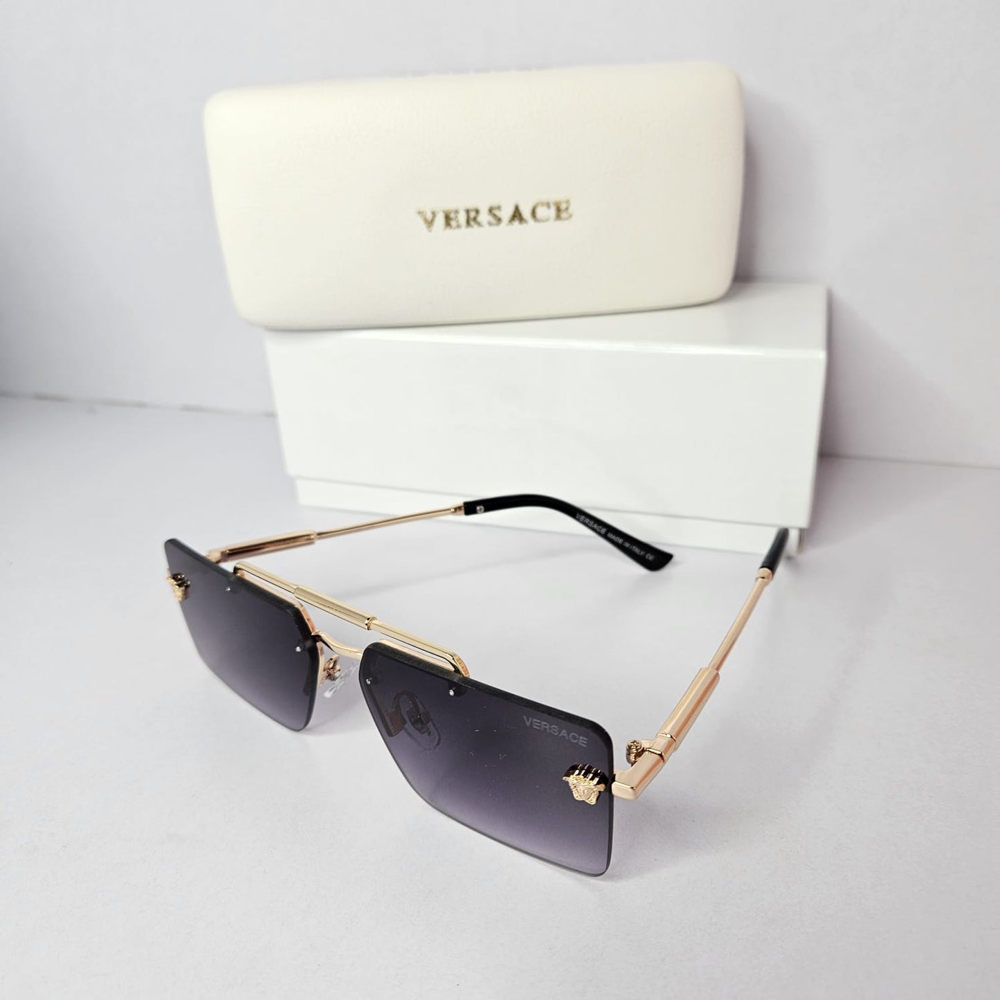 VERSACE Opulent Onyx Shield Sunglasses with Gilded Details