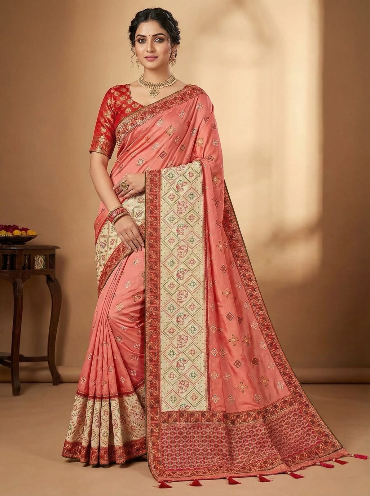 Elegant Weaves Coral Silk Saree with Intricate Gold Embroidery